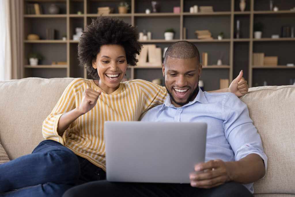 photo of a happy couple at home using AT&T fiber internet