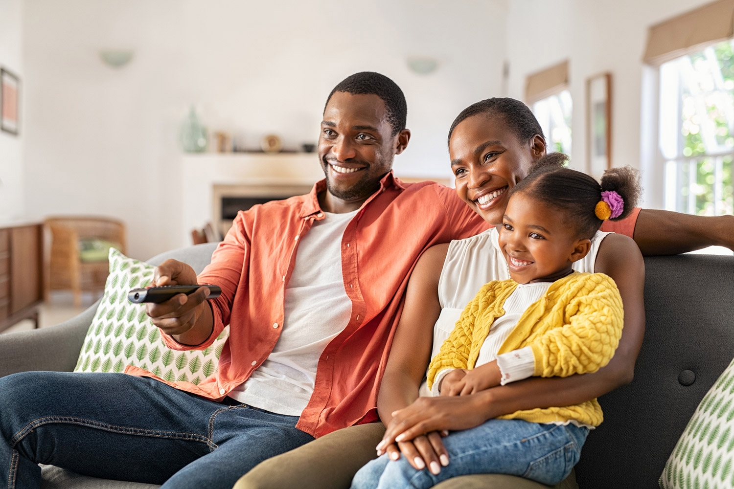 photo of a family at home watching Frndly TV