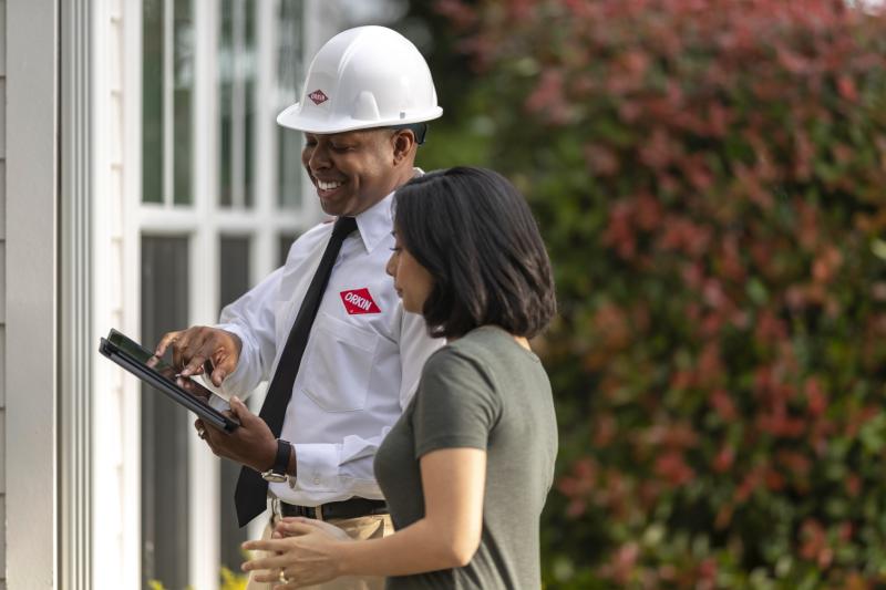 photo of a woman saving money with Orkin