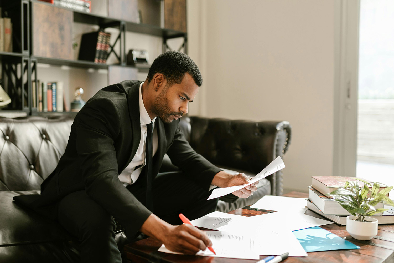 photo of a man looking at important loan documents