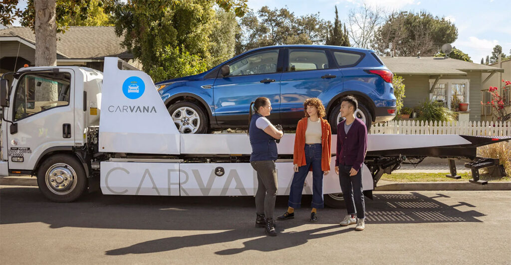 photo of Carvana picking up a car and paying cash