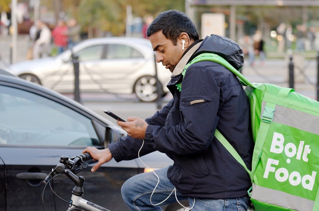 photo of a man delivering food to earn extra income