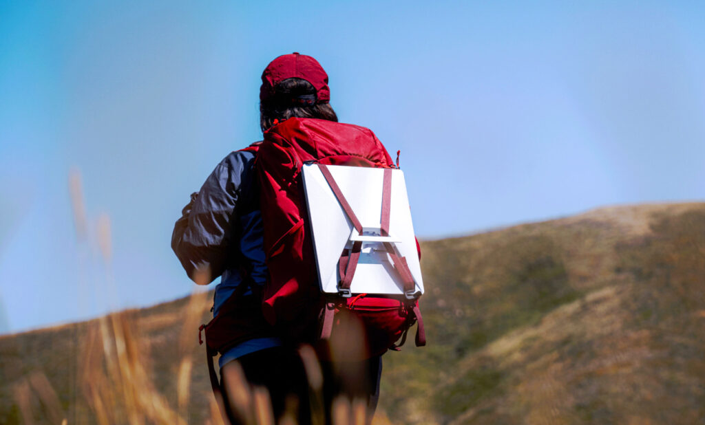 photo of a hiker with the Starlink mini providing internet