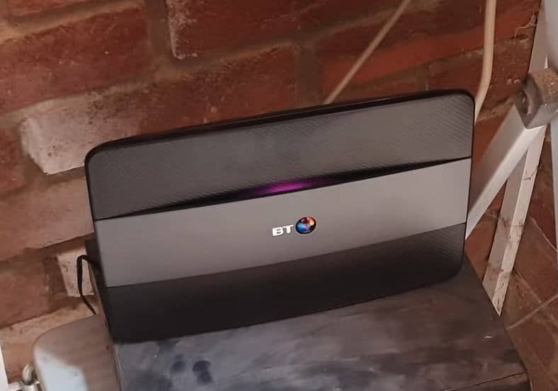 My BT HomeHub internet WiFi router in my garage, with a flashing purple light meaning it can't connect to the internet.