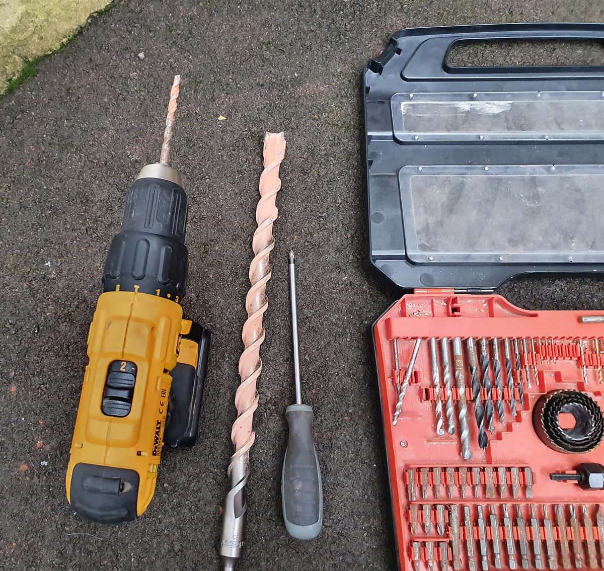 A combi drill with various masonry drill bits