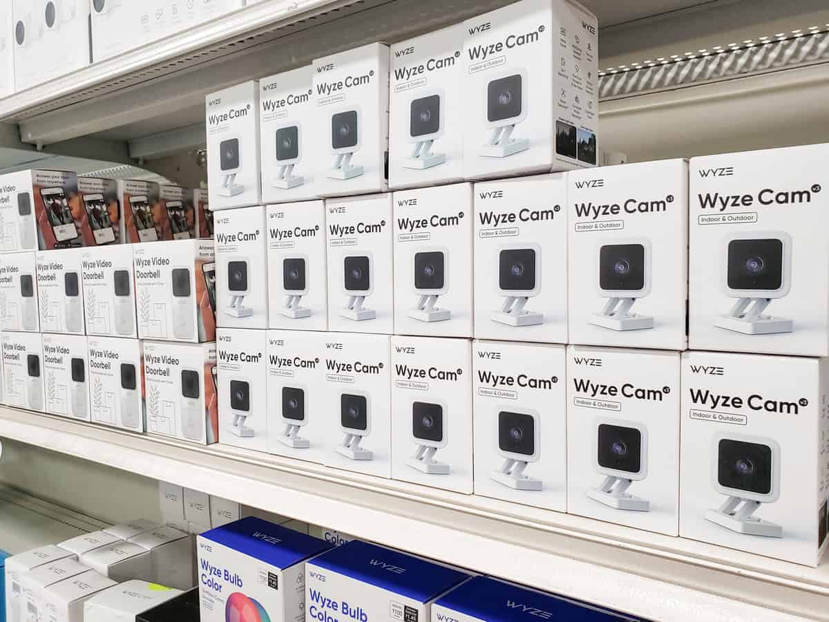 A range of Wyze products including cameras and doorbells at the top and Wyze bulbs at the bottom