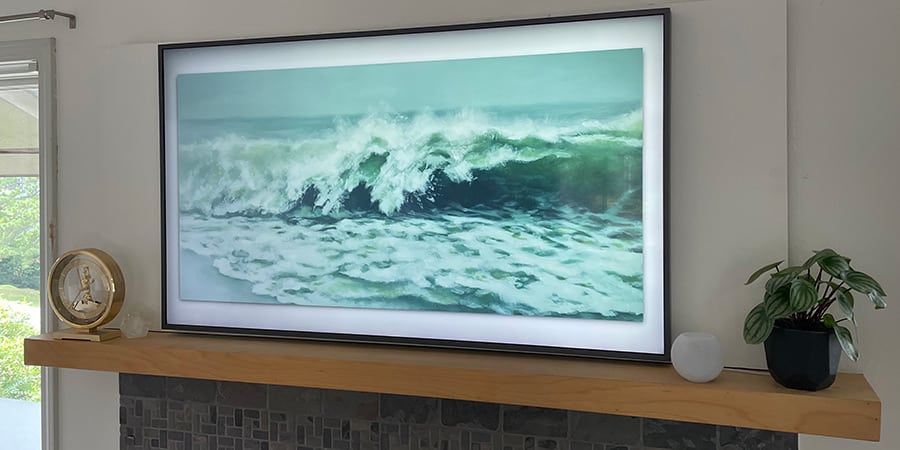 Apple HomePod Mini next to Samsung The Frame TV