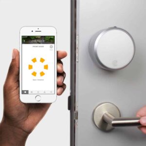 Marketing image showing the August Smart Lock Pro in the background, and a phone app (showing it's unlocked) in the foreground.