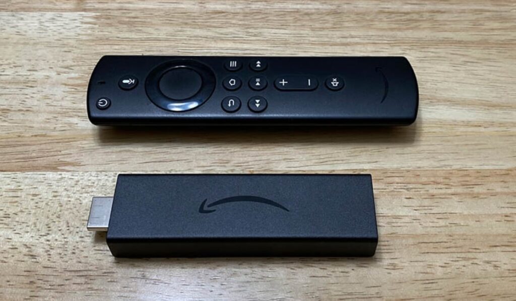 Fire TV Stick and Fire TV Remote Control on Wooden Table - Smaller