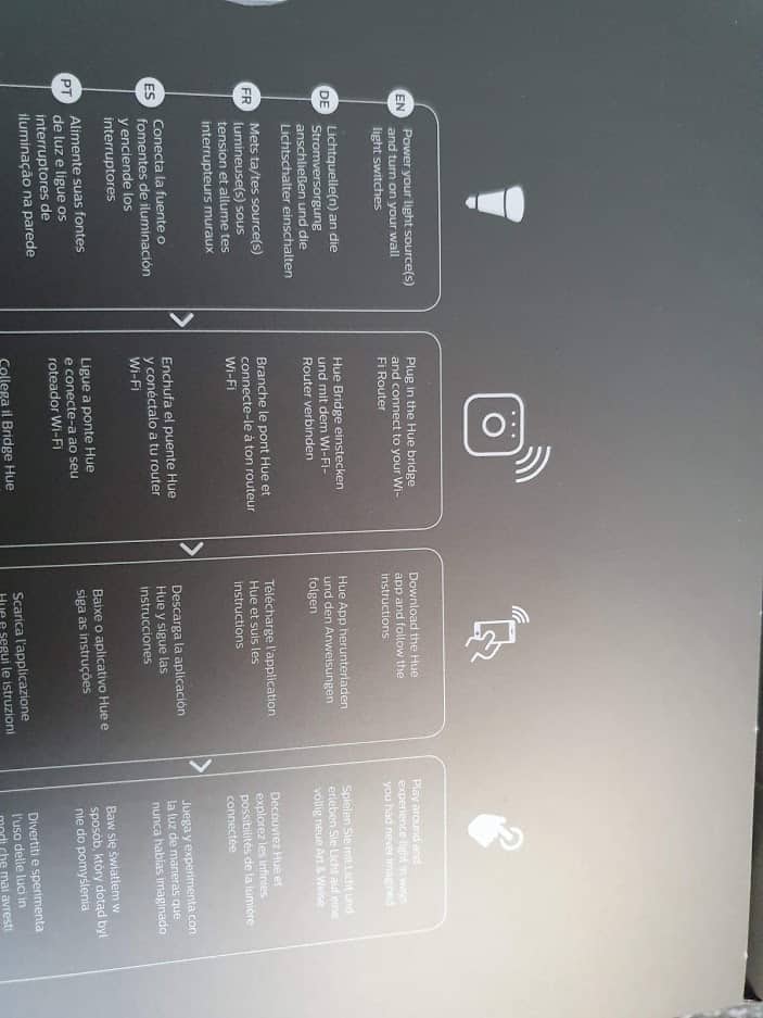 Photo showing the inner text of a Hue starter kit, telling us to "Plug in the Hue bridge and connect to your Wi-Fi Router".