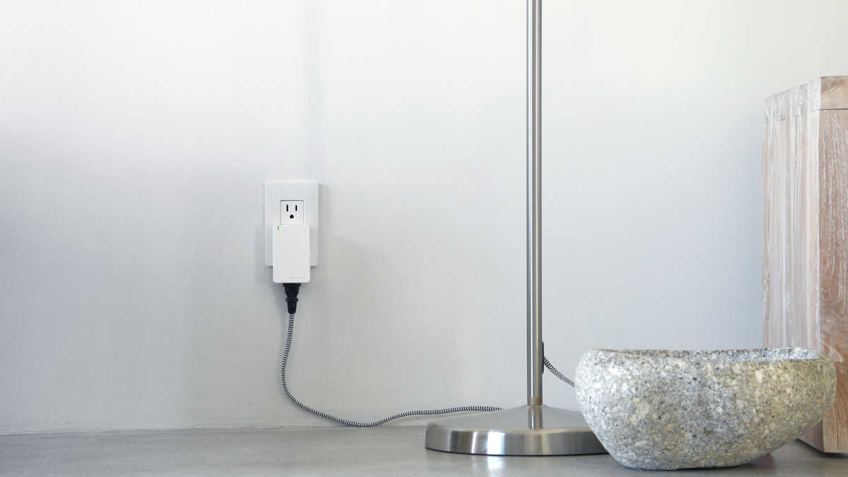 A marketing image of Insteon's plug-in module, essentially a smart plug with dimming support.