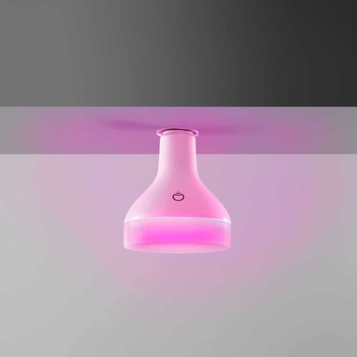 A LIFX BR30 light installed in the ceiling, showing a pink color light.