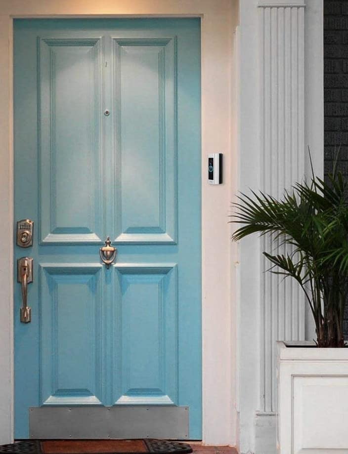 A Ring doorbell with a right-tiling corner mount, avoiding the wall to its left.