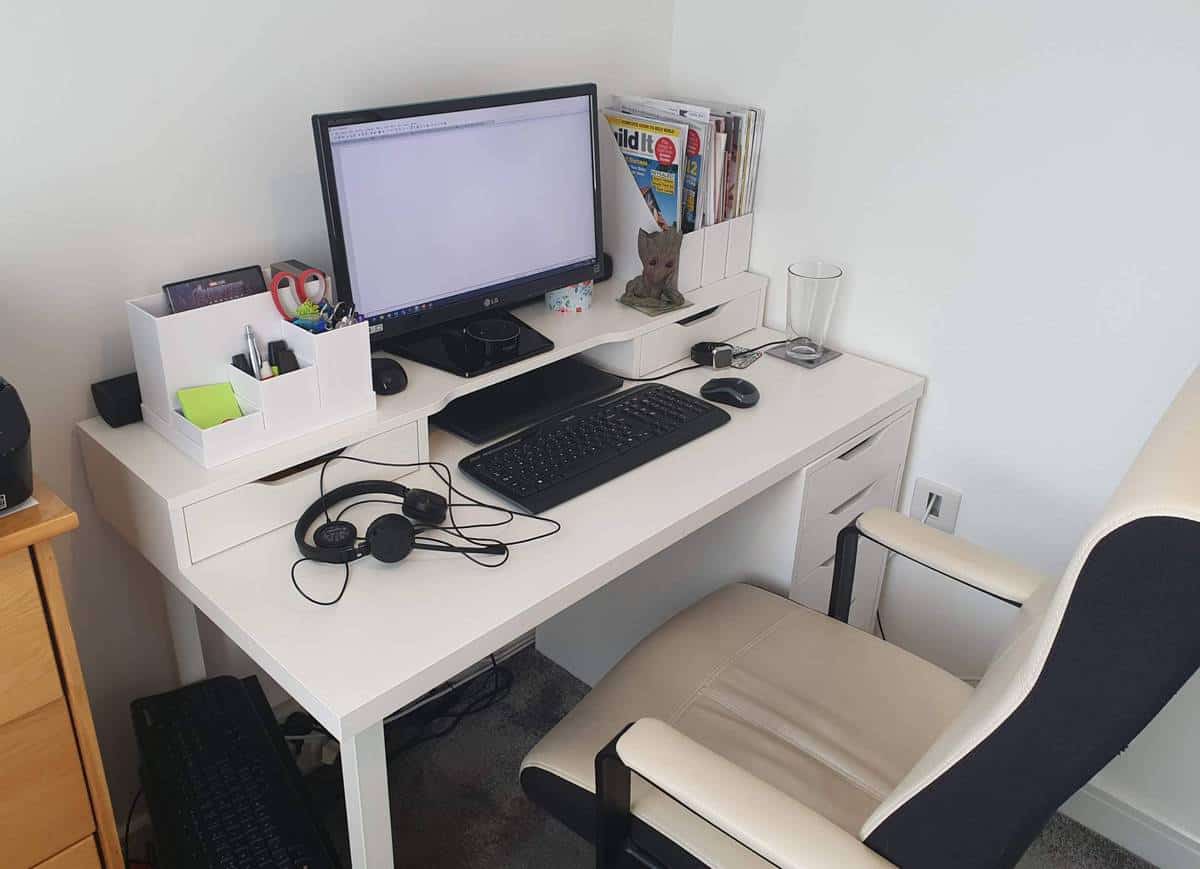 My office computer and desk in natural, daytime light