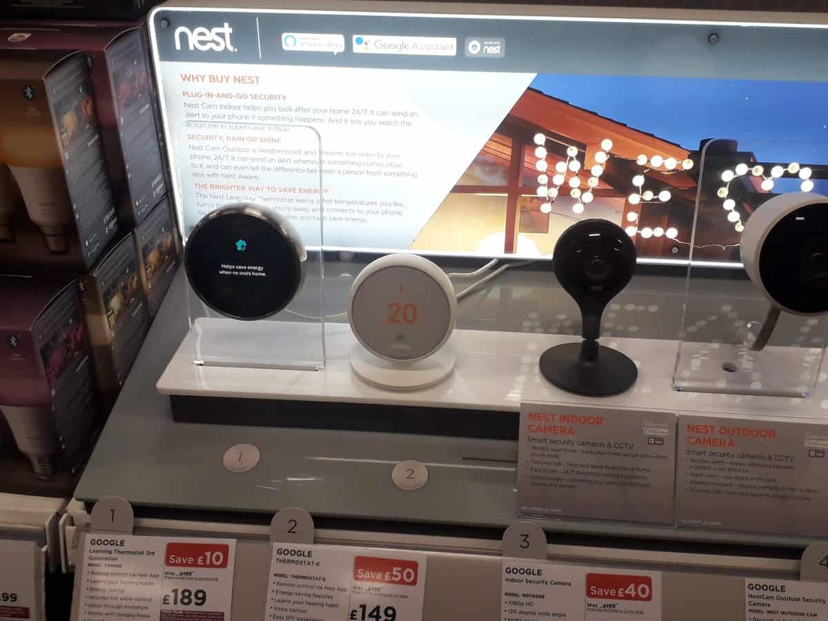 Nest products in store, including the Learning Thermostats and smart security cameras.