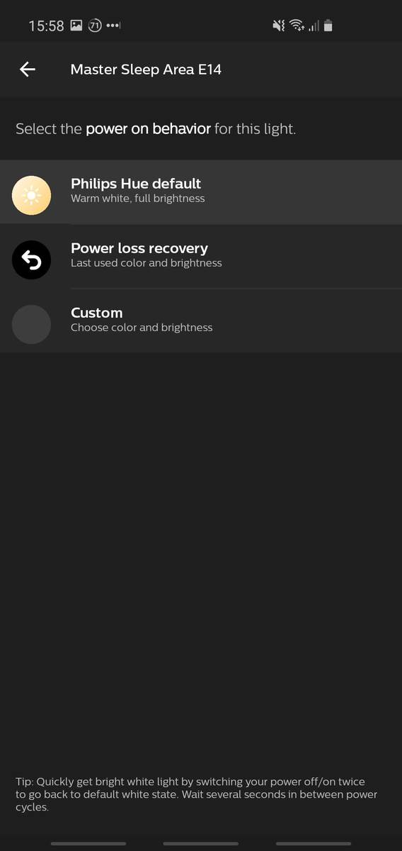 Screenshot of the Philips Hue mobile app, showing the power-on behavior setting for a bulb. Options are "Philips Hue Default", "Power loss recovery" or "Custom".