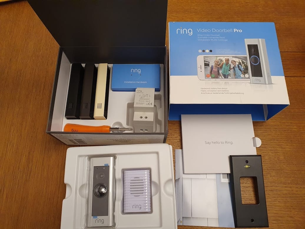 Inside a Ring Doorbell Pro box: showing the doorbell itself, the chime, multiple face plates, transformer, spirit level guide and install instructions.