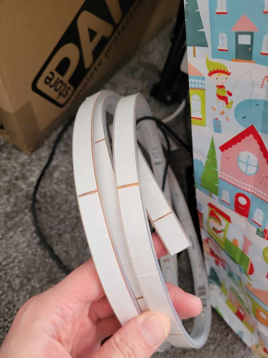 The adhesive stickers on the back of a Philips Hue Lightstrip Plus