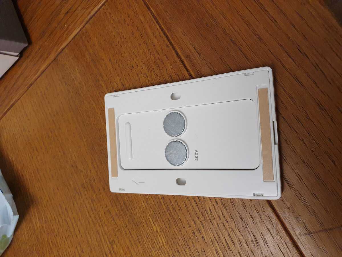 The back of my Philips Hue dimmer switch, with magnets to keep the switch in place