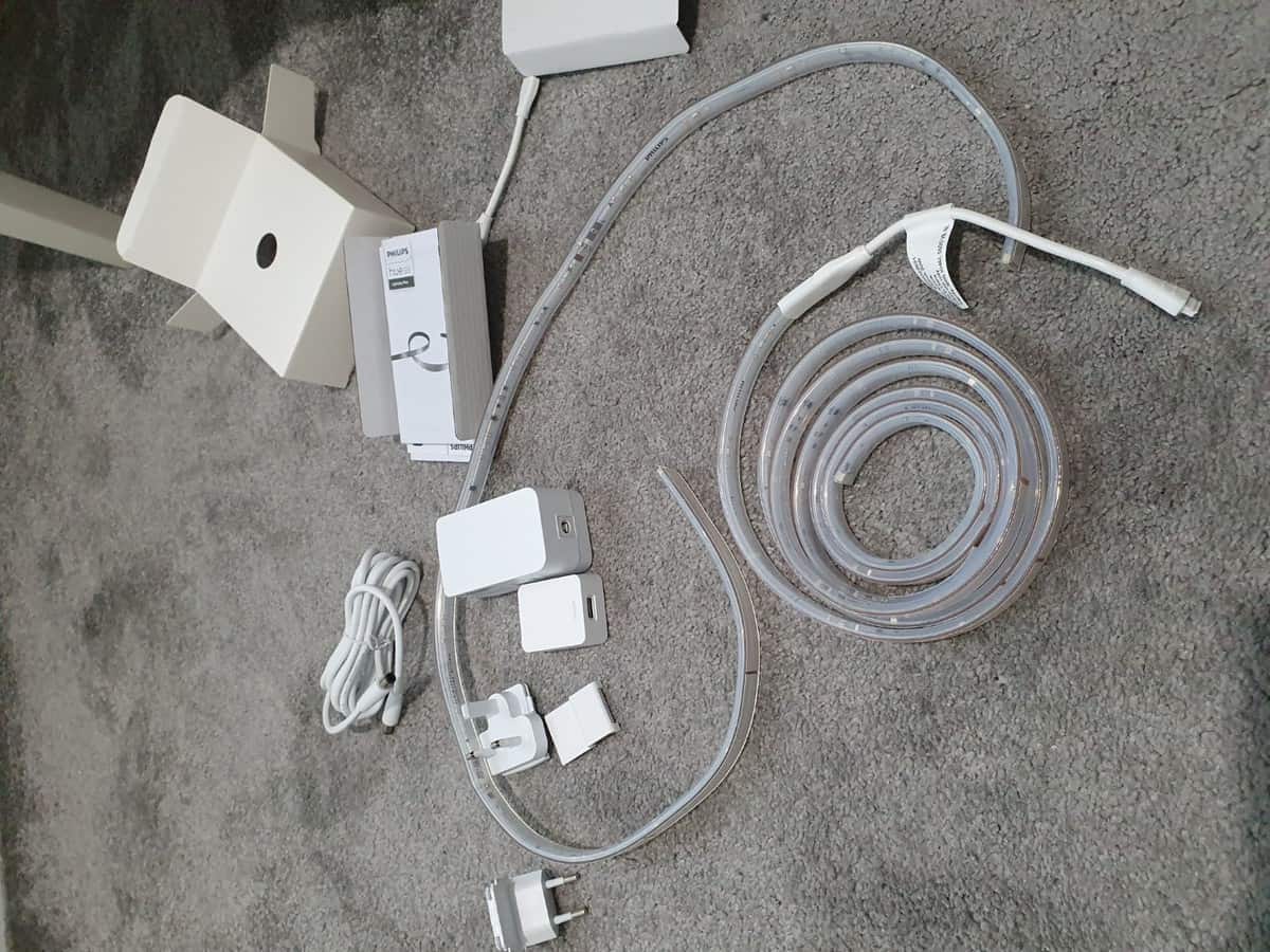 The various parts of a Philips Hue Lightstrip V4 base and extension kit