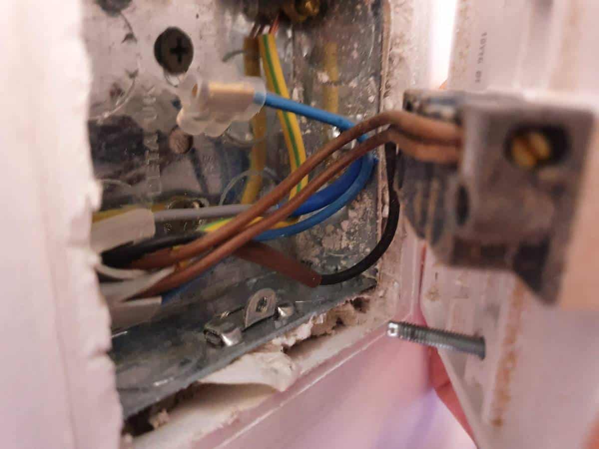 The wiring inside a UK light switch containing a neutral