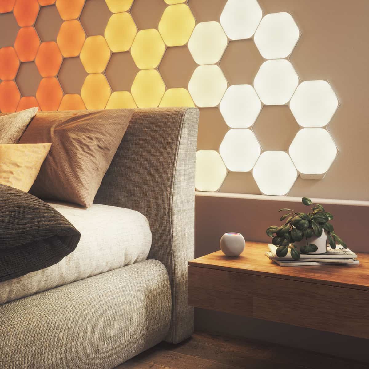 Various Nanoleaf shapes on bedroom feature wall with HomePod Mini