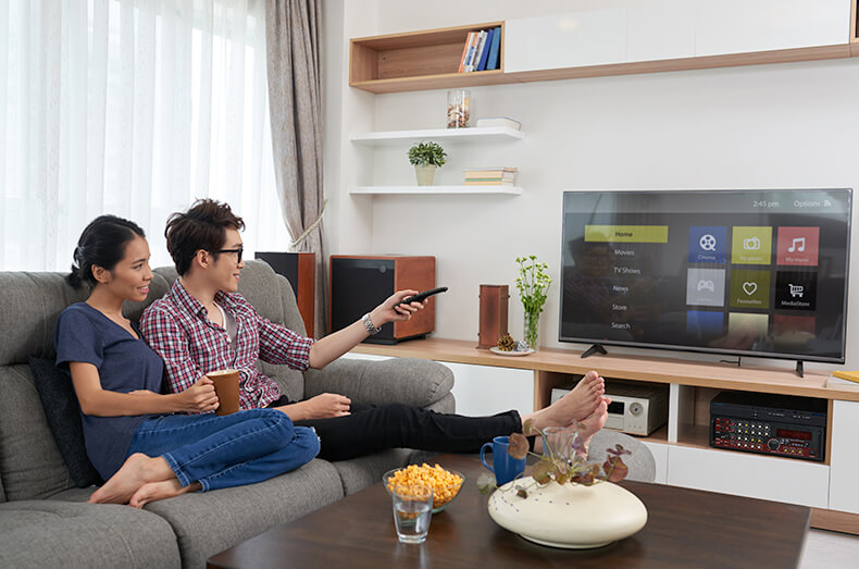 photo of a couple watching Sparklight TV