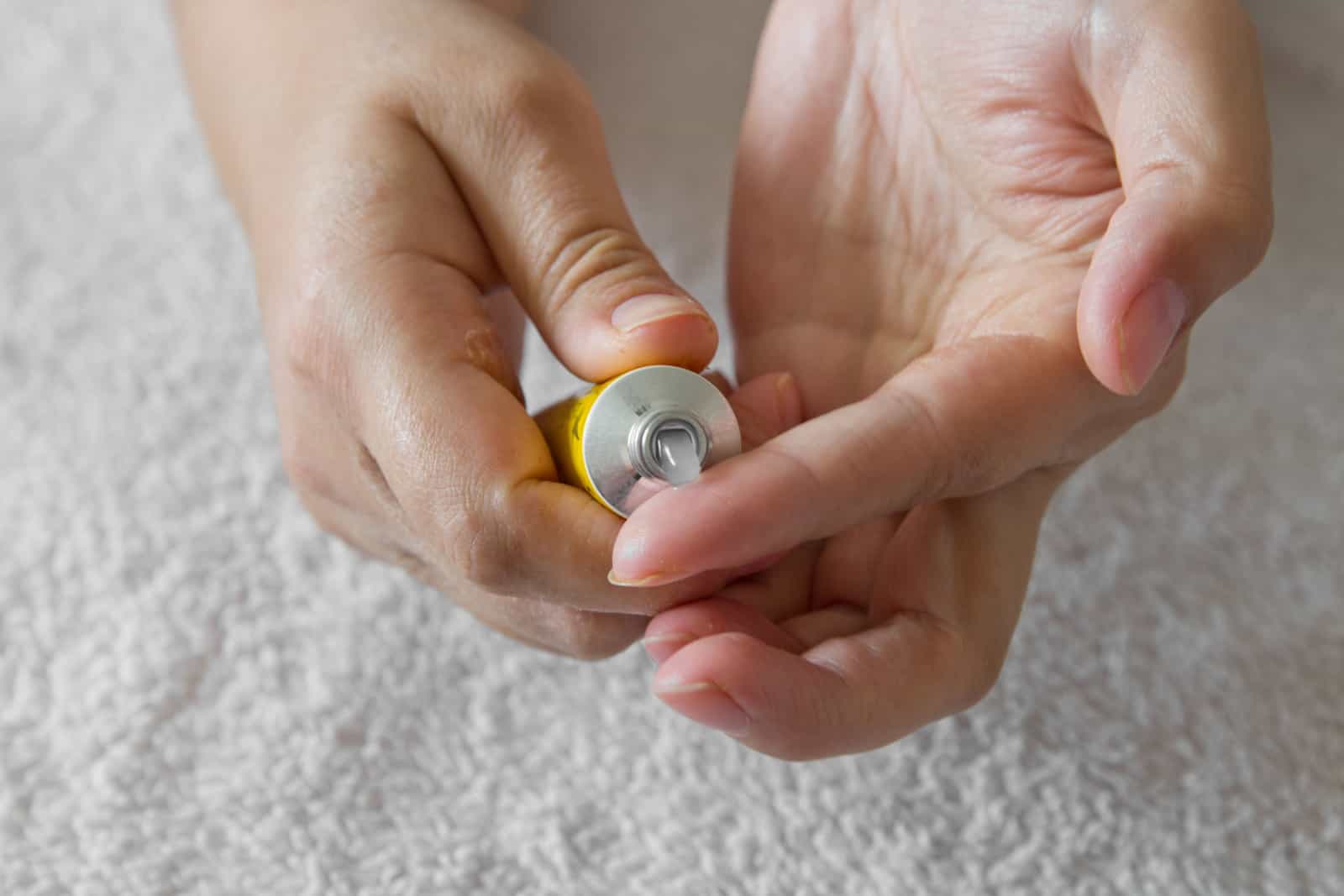 Applying the ointment and emollient cream in the treatment and hydration of the skin