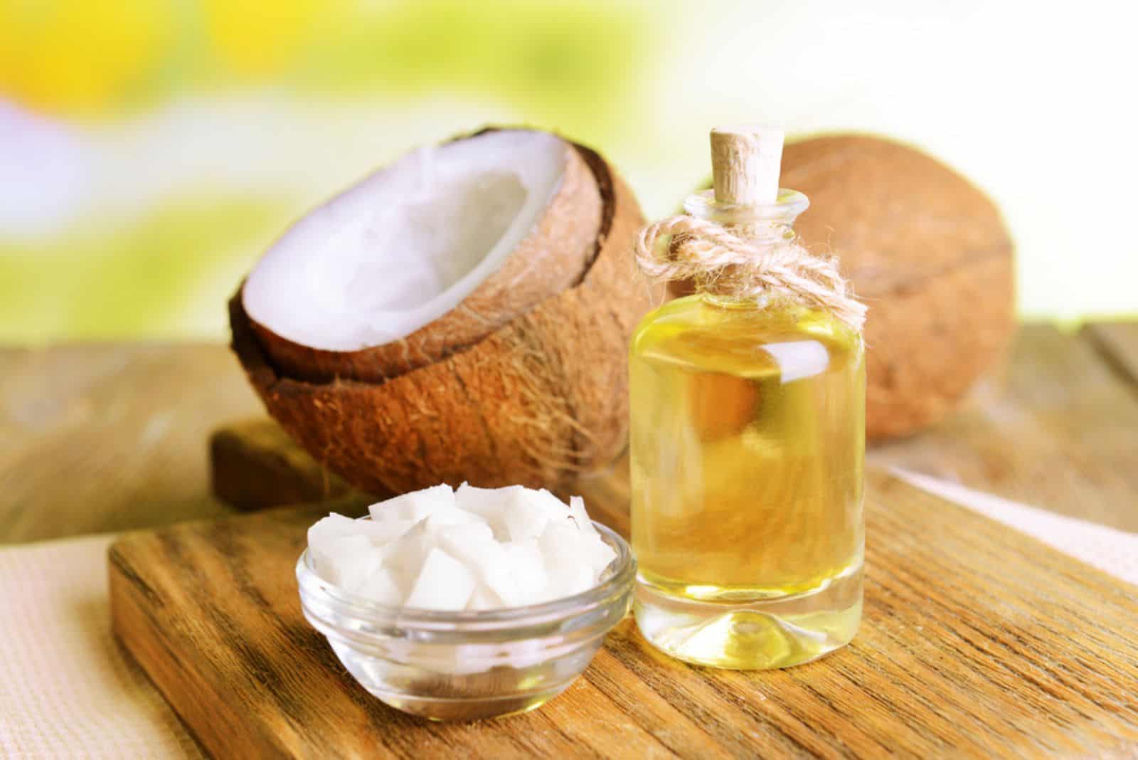 Coconut oil on table on light background