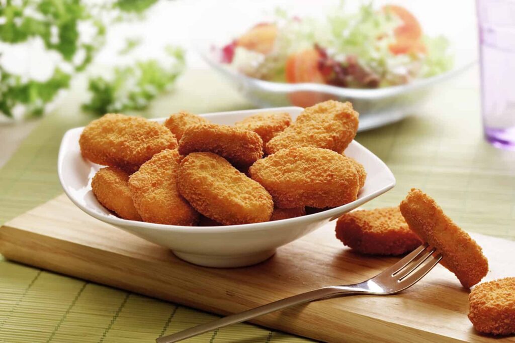 chicken nuggets served in a white bowl