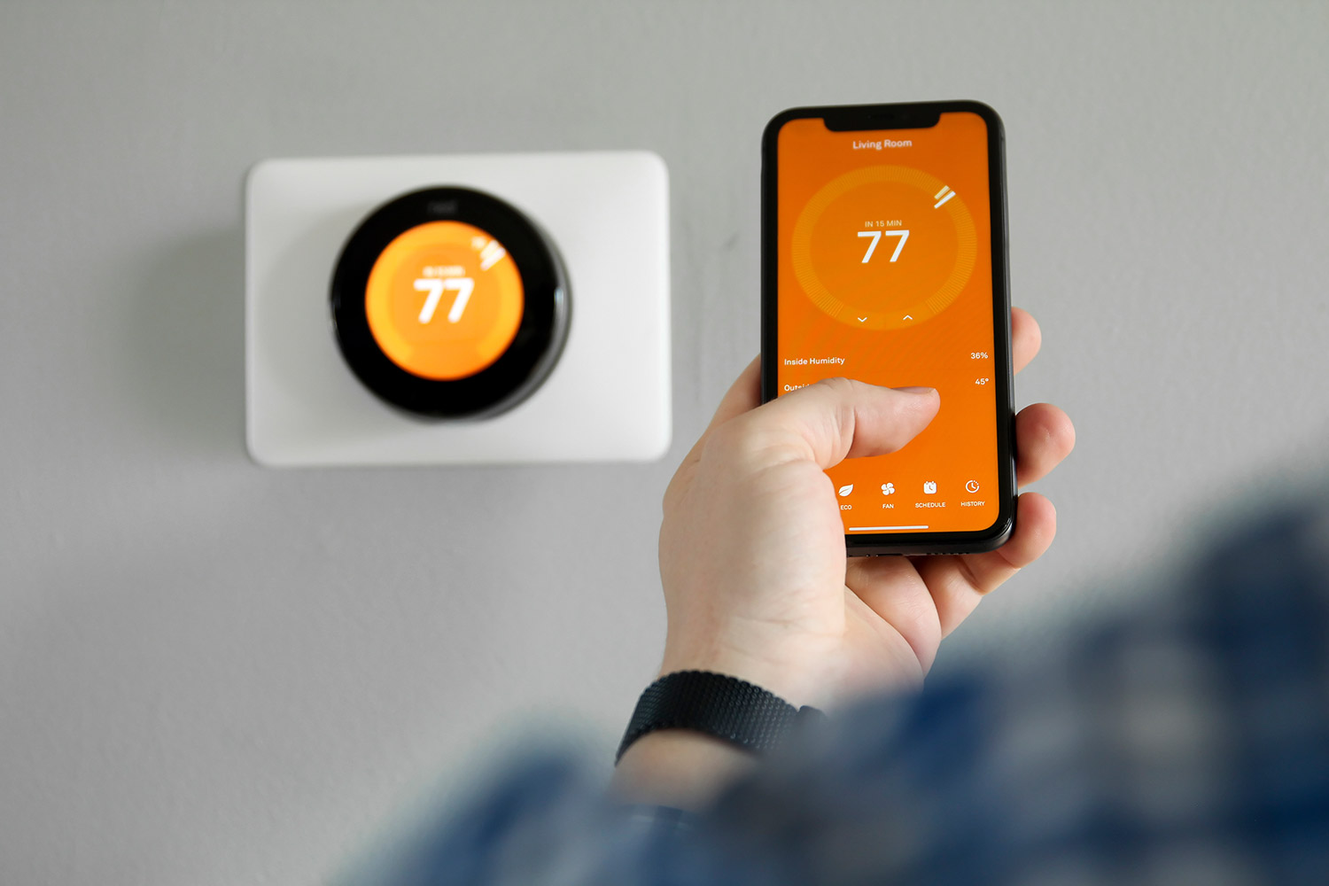 photo of a person using smart home technology