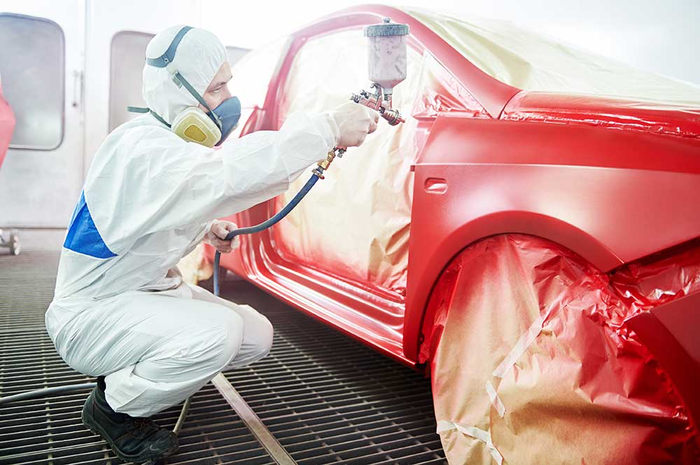 Painter painting car door