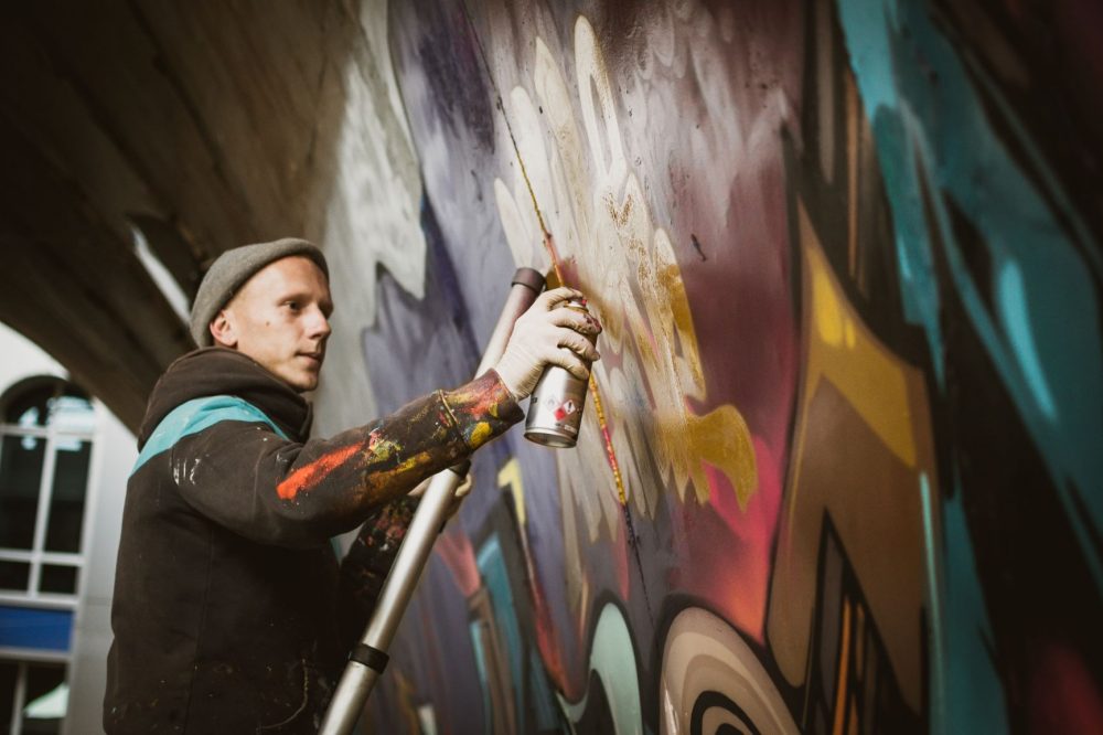 Graffiti artist painting