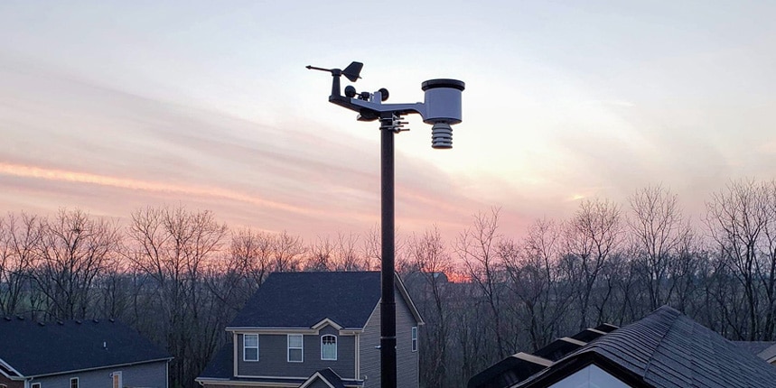 Ambient Weather WS-2902C installed on the roof of a house