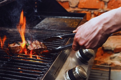 Check a grill's temperature with an infrared thermometer