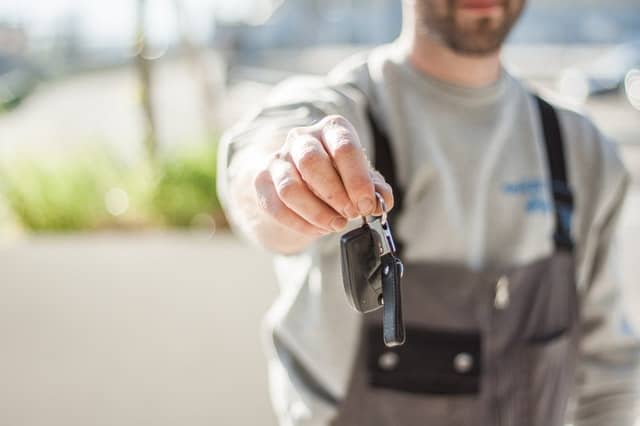 mechanic delivering car keys