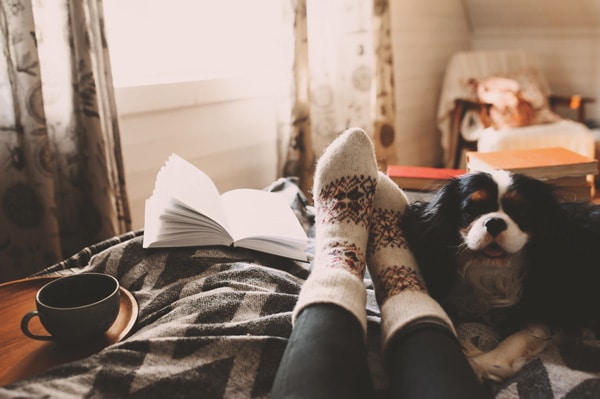 Person relaxing in a cozy room