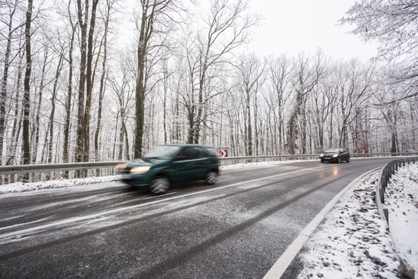 Cars driving on icy road