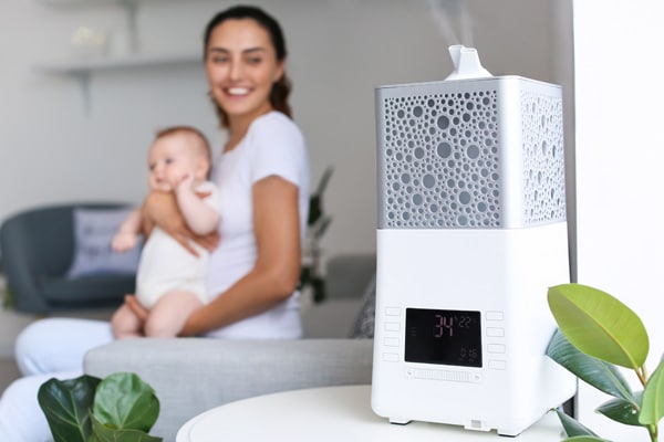 Humidifier in a room with a mother and her baby