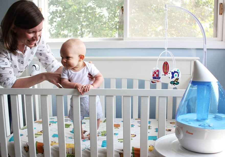 Humidifier in a nursery with baby and mom