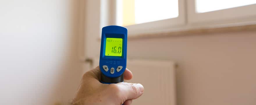 Infrared thermometer being used in a home