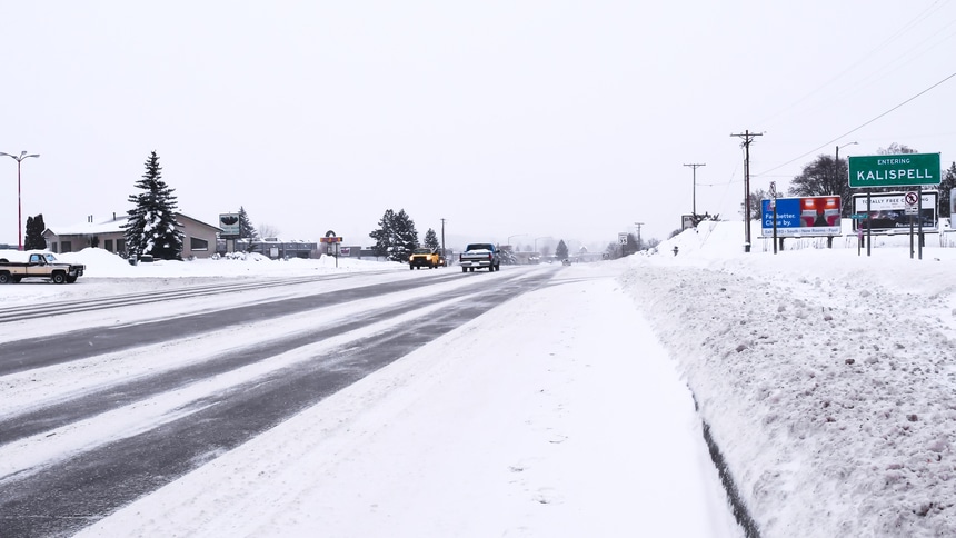 Kalispell, Montana city limits sign in winter