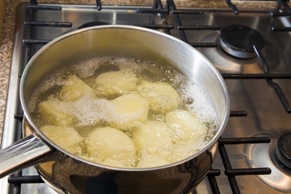 Potatoes boiling on a stovetop