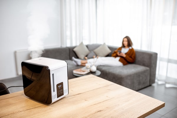 Women relaxing with humidifier running