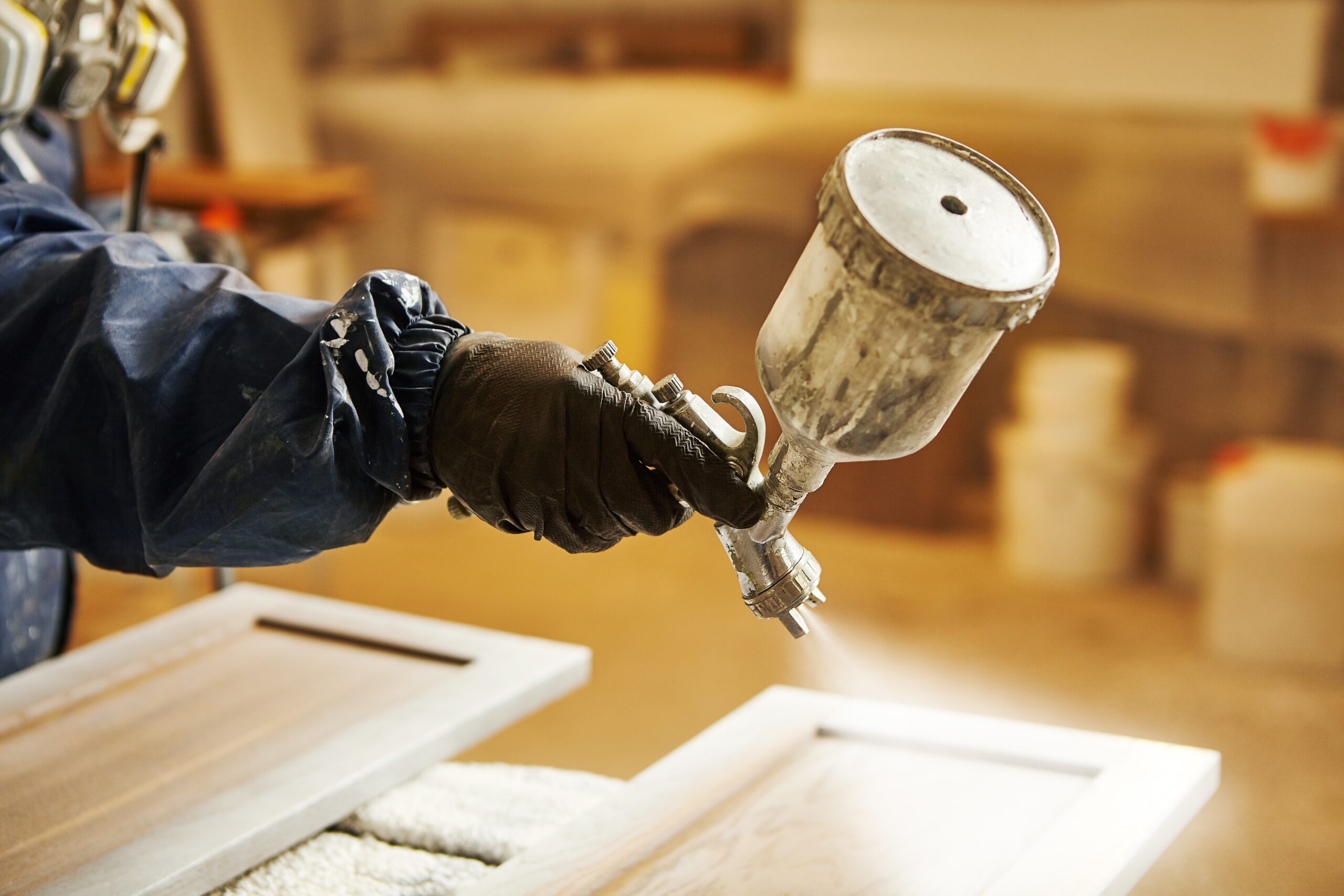 Staining wood with a spray gun