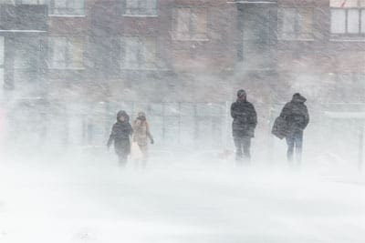 People walking in blizzard conditions