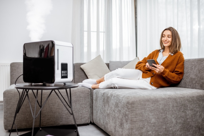 Humidifier in a living area with a woman relaxing