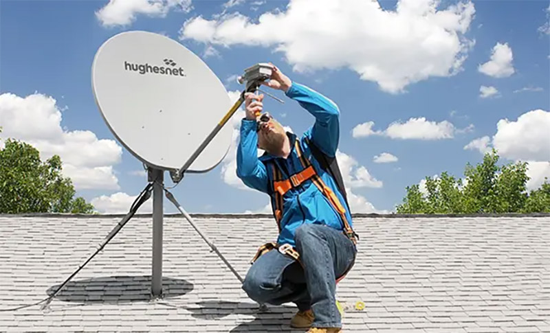 photo of  a Hughesnet dish installer