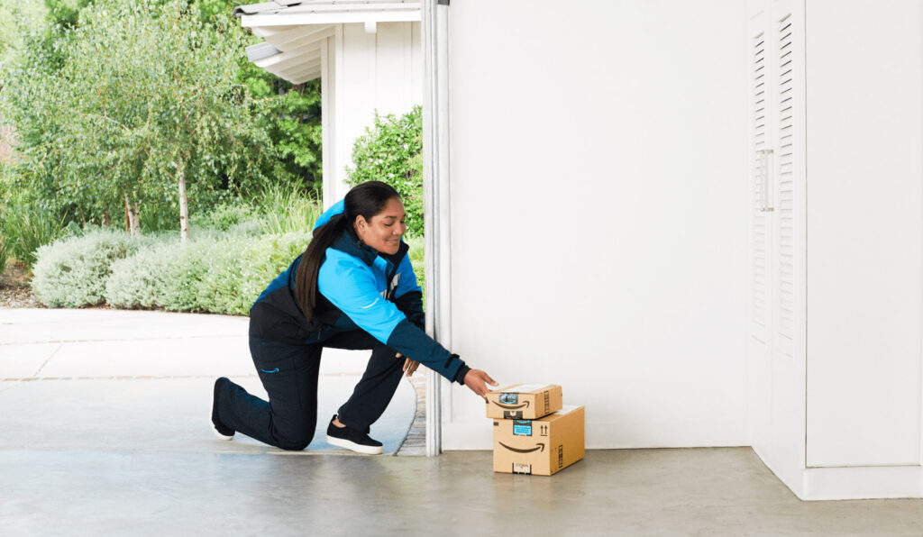 photo of an Amazon Key delivery driver dropping off Amazon packages in the garage