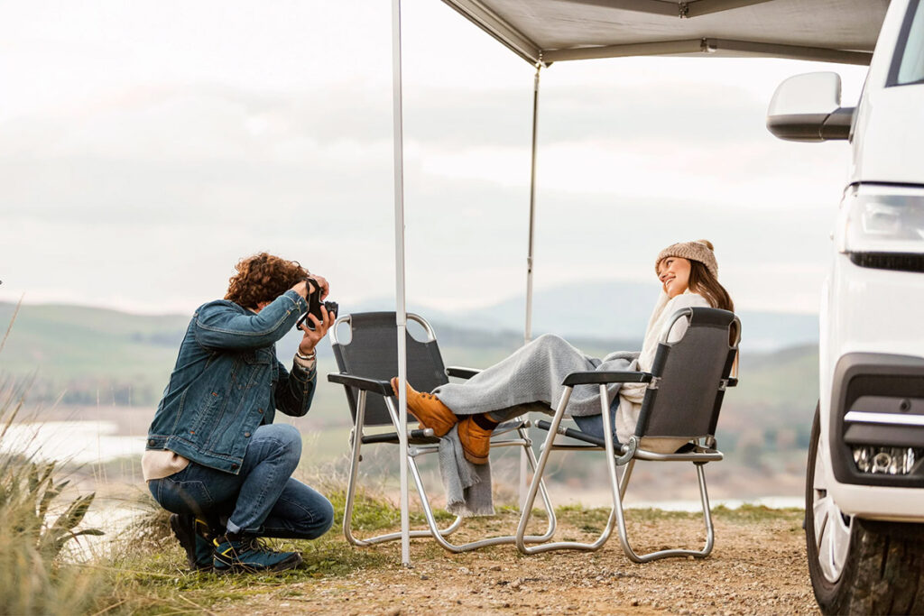 photo of a man and woman camping in a rural area